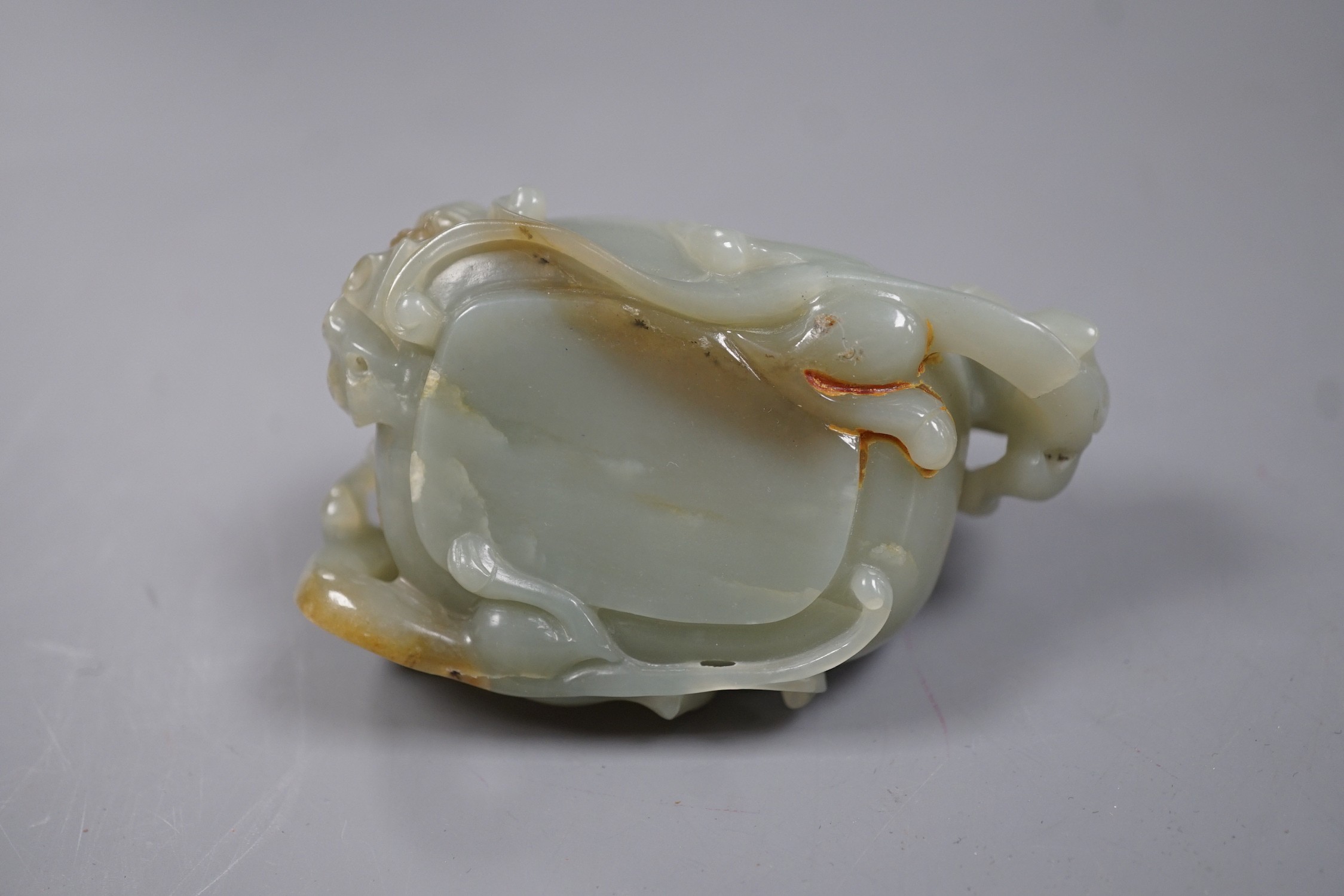 A Chinese celadon jade brushwasher, dragons